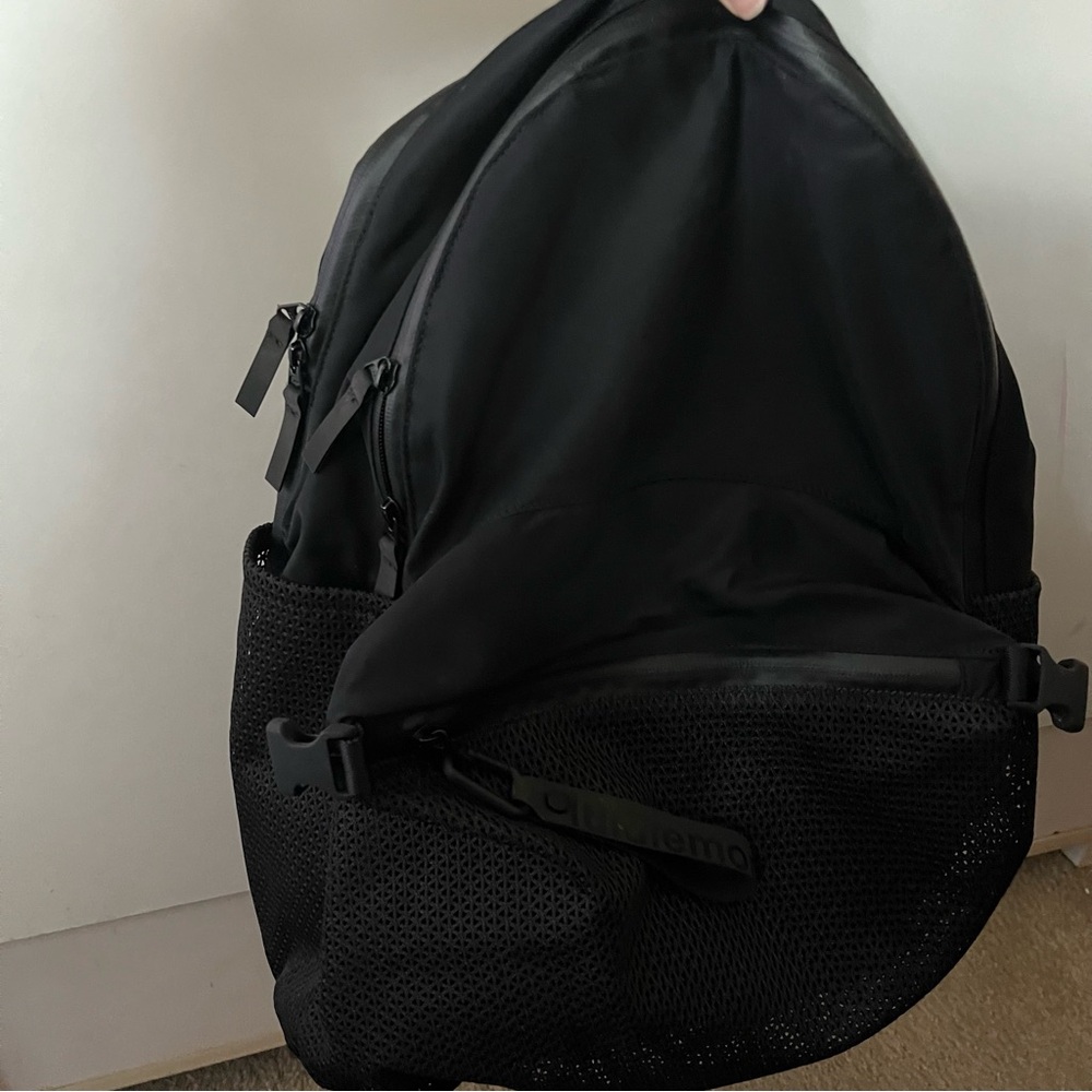 Lululemon Black Backpack with mesh pocket and keychain